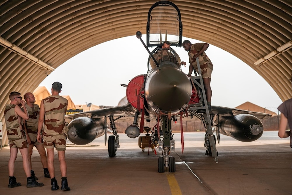 French Barkhane Air Force mechanics maintain a Mirage 2000 on the Niamey, Niger base, on June 5, 2021. (AP)