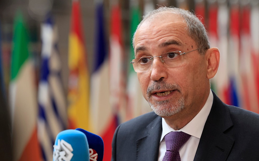 Jordan's Minister of Foreign Affairs Ayman Safadi speaks with the media as he arrives for a meeting at the European Council building in Brussels, on May 27, 2024. (AP)