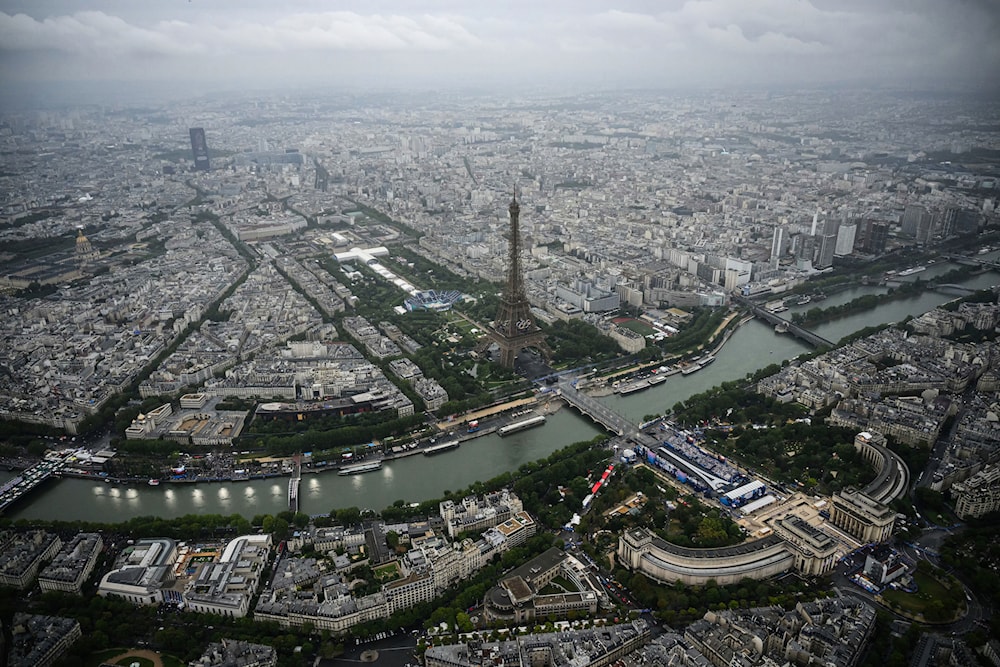 An aerial view of the Eiffel Tower across the Seine river in Paris, France, during the opening ceremony for the 2024 Summer Olympics, Friday, July 26, 2024. (AP)