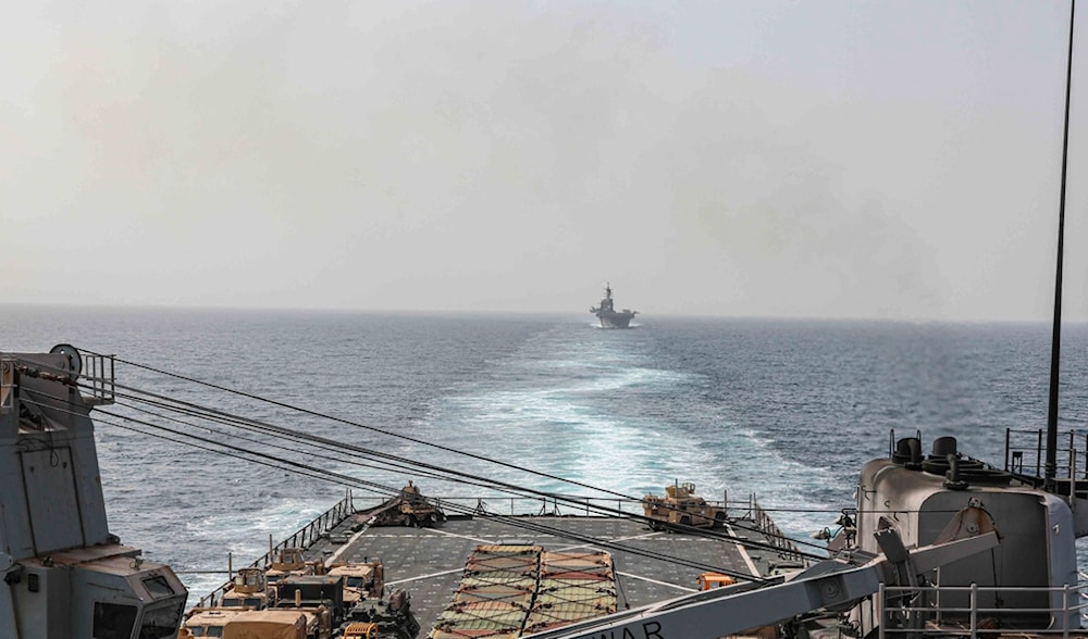 In this image provided by the U.S. Navy, the amphibious dock landing ship USS Carter Hall and amphibious assault ship USS Bataan transit the Bab al-Mandeb strait on Aug. 9, 2023. (AP)