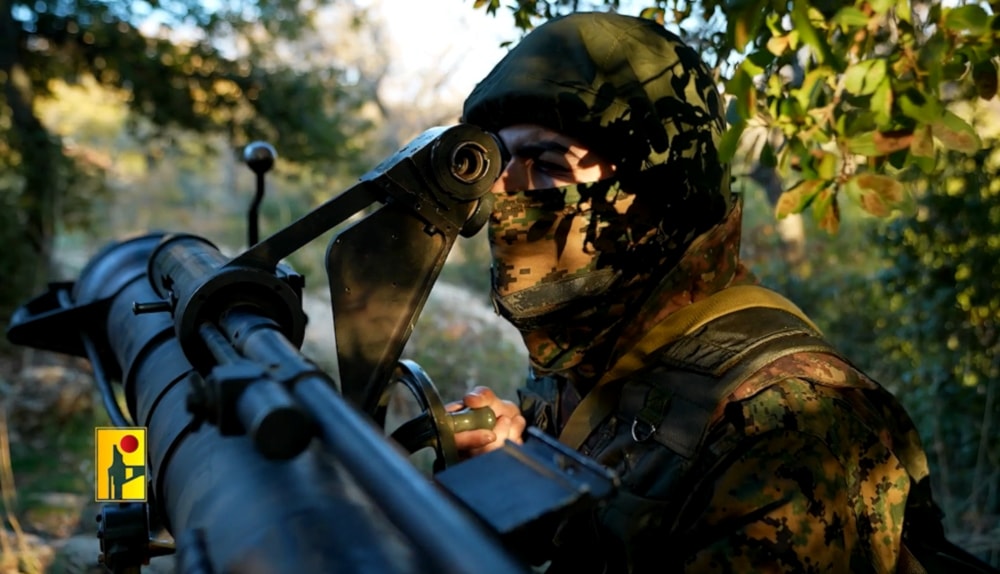 A Hezbollah fighter aims a recoilless rifle in a cinematic video published by the Military Media, on January 18,2024. (Islamic Resistance in Lebanon / Military Media)