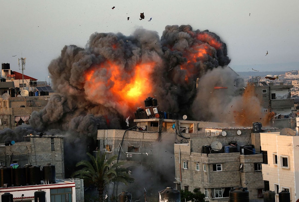 A ball of fire erupts from a building in Gaza City's Rimal residential district May 16, 2021. (AFP via Getty Images)