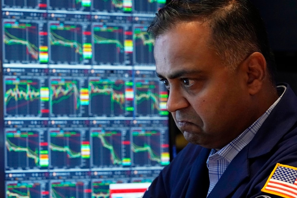 Specialist Dilip Patel works at his post on the floor of the New York Stock Exchange, Monday, Aug. 5, 2024. (AP)