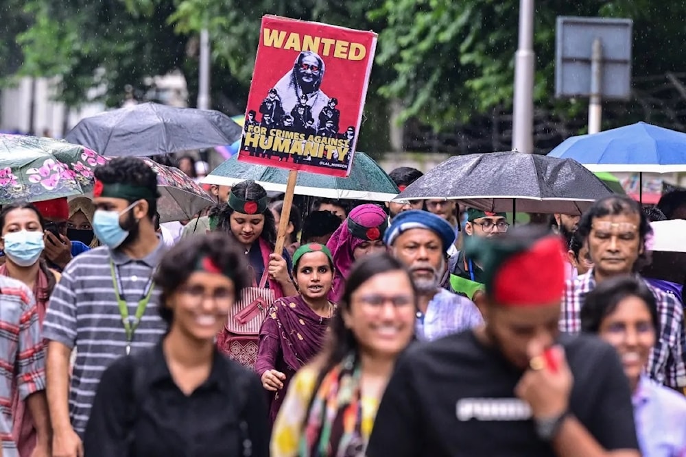 Activists take part in a protest march as they demand justice for victims arrested and killed in the recent countrywide violence in Dhaka on August 2, 2024. (AFP)