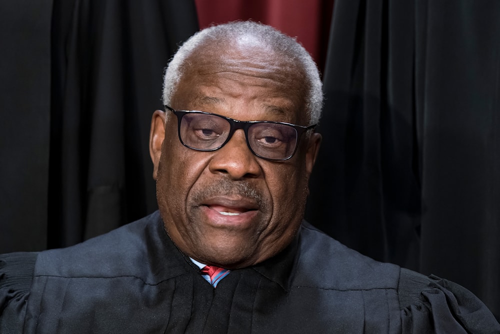 Associate Justice Clarence Thomas poses for a photo at the Supreme Court building in Washington, October 7, 2022 (AP)