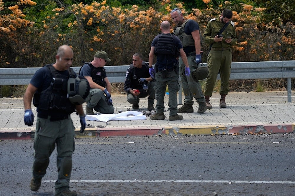 Israeli forces work at the site of a drone strike in Nahariya, 'Israel', Tuesday, Aug. 6, 2024. (AP)