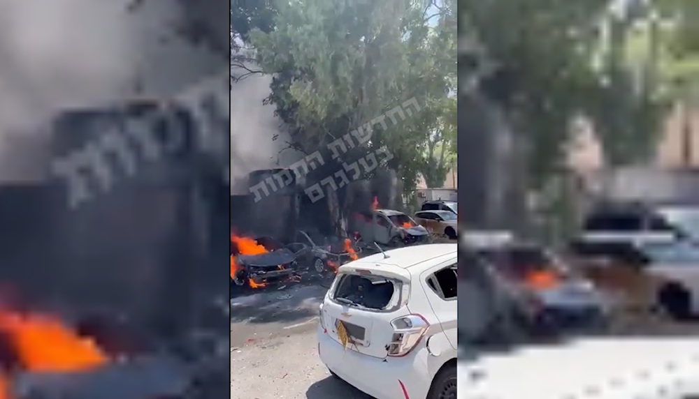 A screengrab from a video posted on social media shows vehicles burning in the Sheraga military base near Nahariya, northern occupied Palestine, August 6, 2024 (Social media)