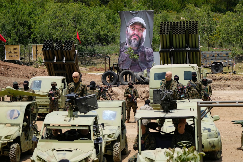 Fighters from the Lebanese militant group Hezbollah carry out a training exercise in Aaramta village in the Jezzine District, southern Lebanon, Sunday, May 21, 2023 (AP)