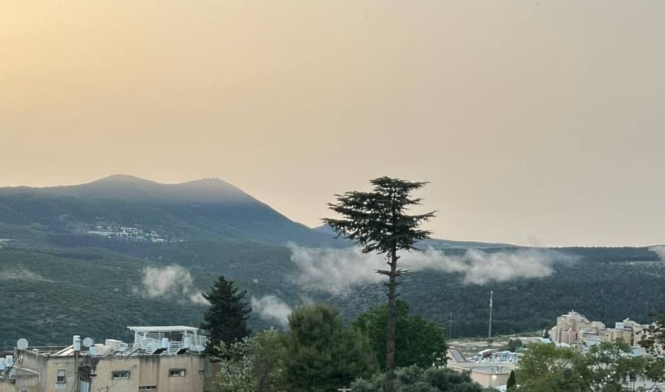 A picture showing smoke rising following a previous operation on the Ein Zeitim base, near Safed, in northern occupied Palestine. (Social media)