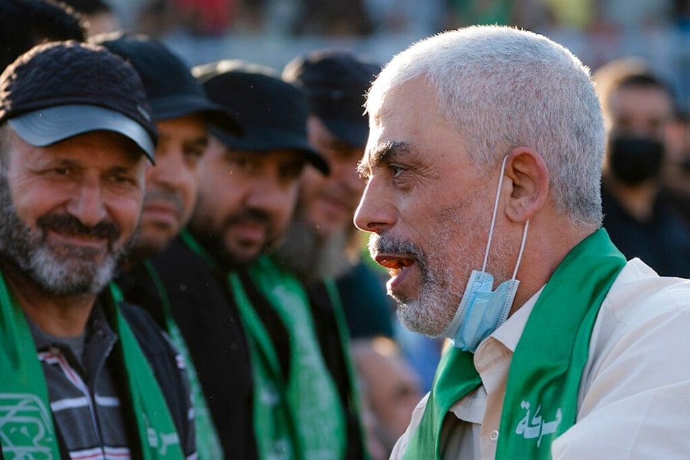 Yahya Sinwar, Palestinian leader of Hamas in the Gaza Strip, greets supporters at a rally Monday, May 24, 2021, in Gaza City, the Gaza Strip. (AP Photo/John Minchillo)