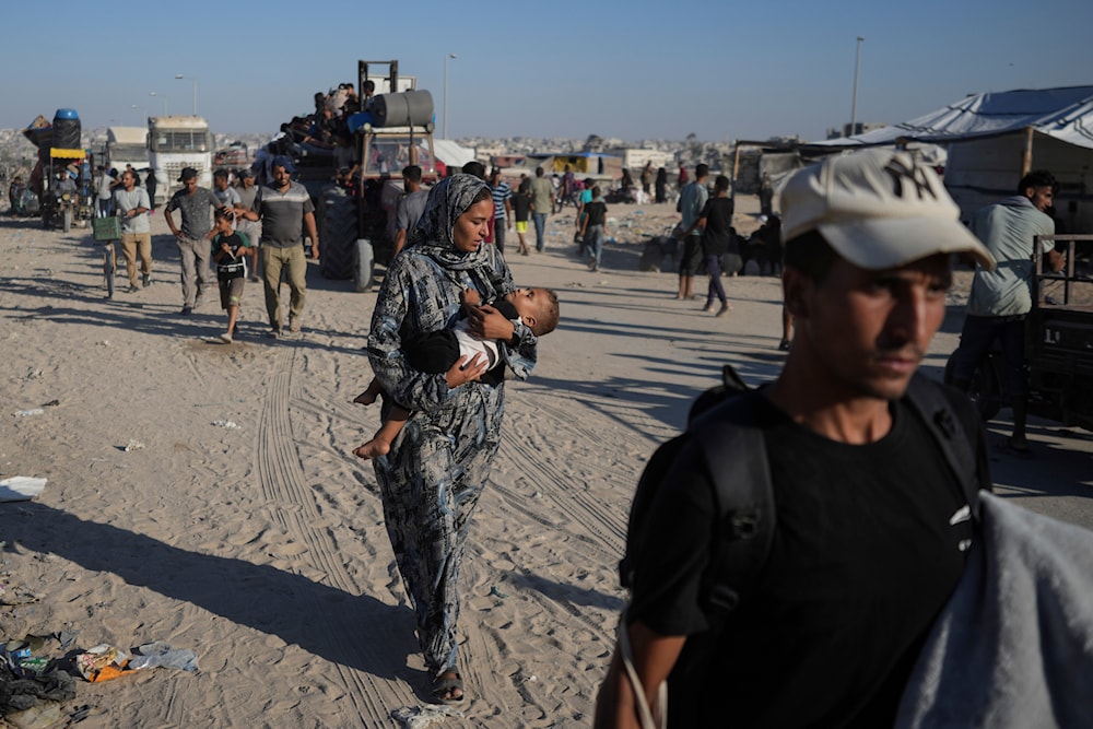 Palestinians flee the Khan Younis area of the Gaza Strip, following Israeli military evacuation orders, saying the IOF would soon operate there, Thursday, August 8, 2024 (AP)