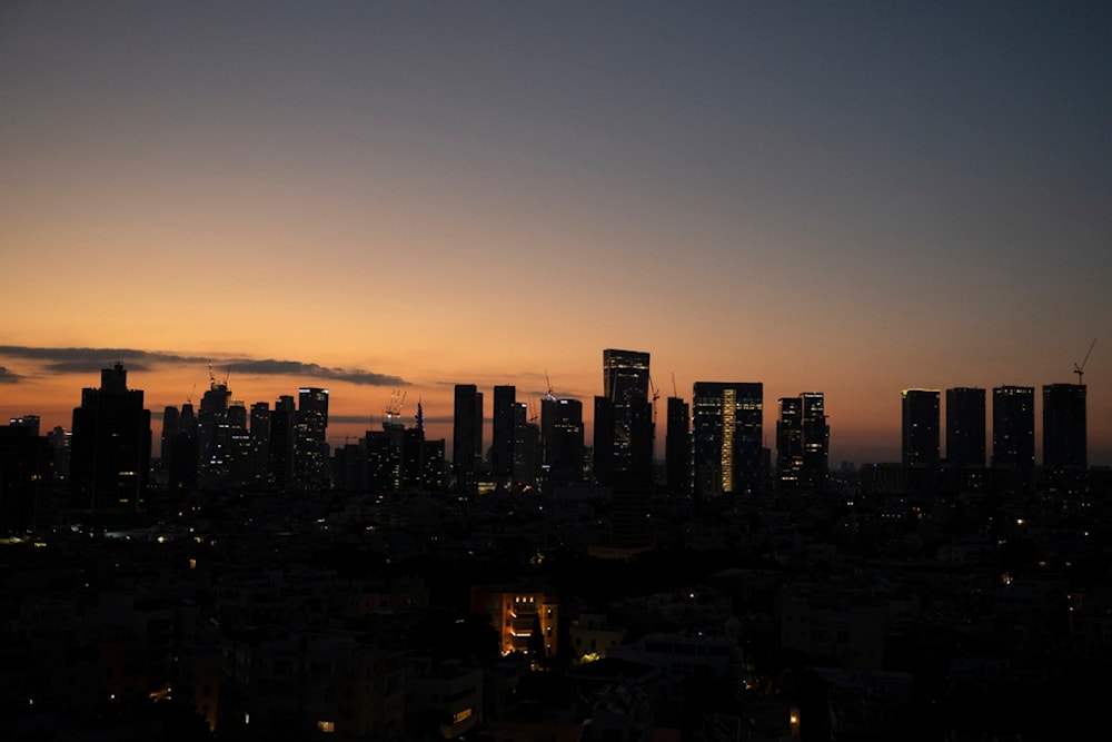 Skyscrapers are seen lined in the Tel Aviv skyline during the dawn, occupied Palestine, Tuesday, Aug. 6, 2024. (AP Photo/Leo Correa)