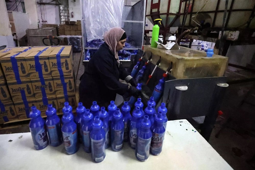 An employee working at Bishara Jubran’s household products and cosmetics factory in the occupied west bank city of Ramallah. (AFP)