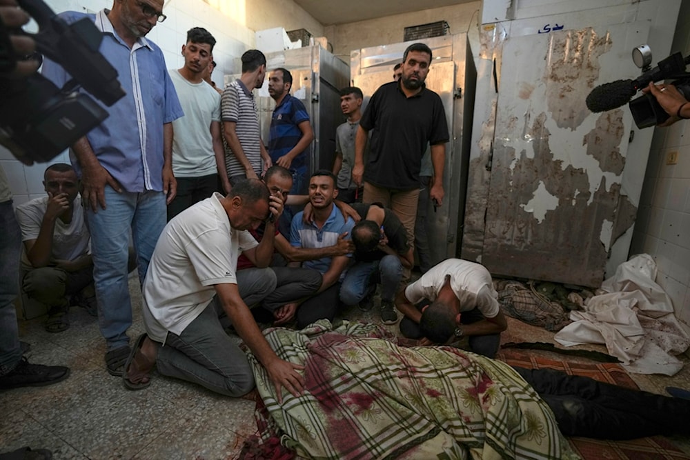 Palestinians mourn the victims of an Israeli airstrike in Deir al Balah, Gaza Strip, Tuesday, Aug. 6, 2024. (AP)