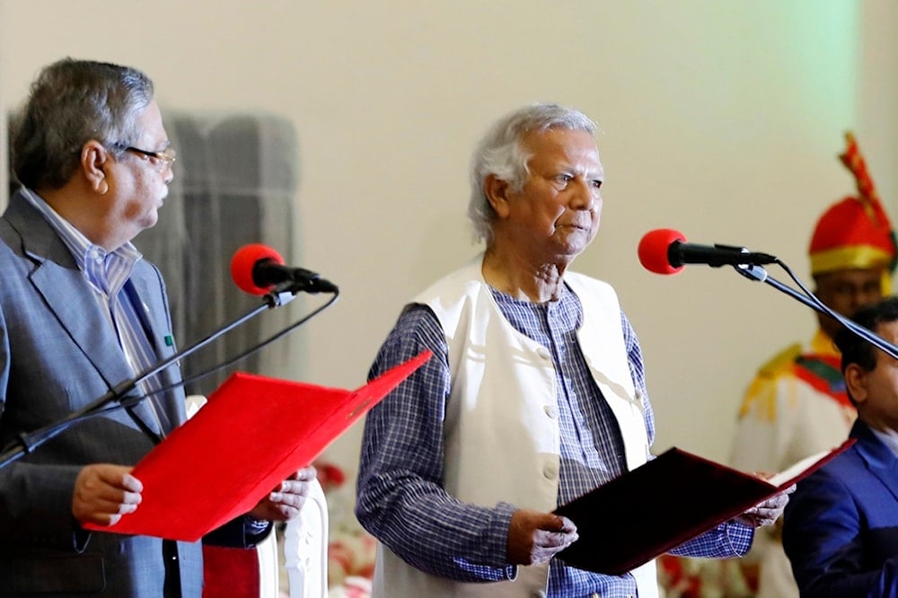 Bangladesh's figurehead President Mohammed Shahabuddin administers the oath of office to Nobel laureate Muhammad Yunus, right, as the head of Bangladesh's interim government, in Dhaka, Bangladesh, Thursday, Aug. 8, 2024. (AP)