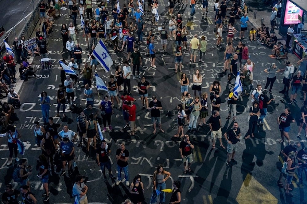 Israeli settlers protest against Prime Minister Benjamin Netanyahu's government and call for the release of captives held in the Gaza Strip, in Yaffa, occupied Palestine, Saturday, August 31, 2024 (AP)