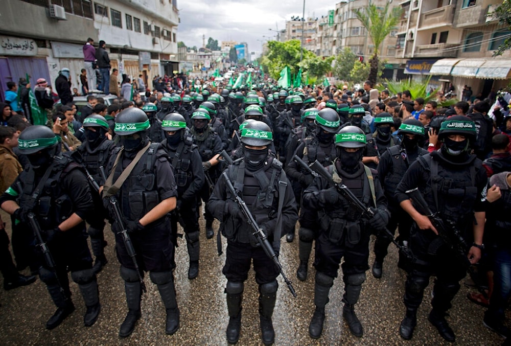 In this Dec. 14, 2014, file photo, masked Palestinian Resistance movement, Hamas, rally to commemorate the 27th anniversary of the group in Gaza City, Gaza Strip, Palestine. (AP)