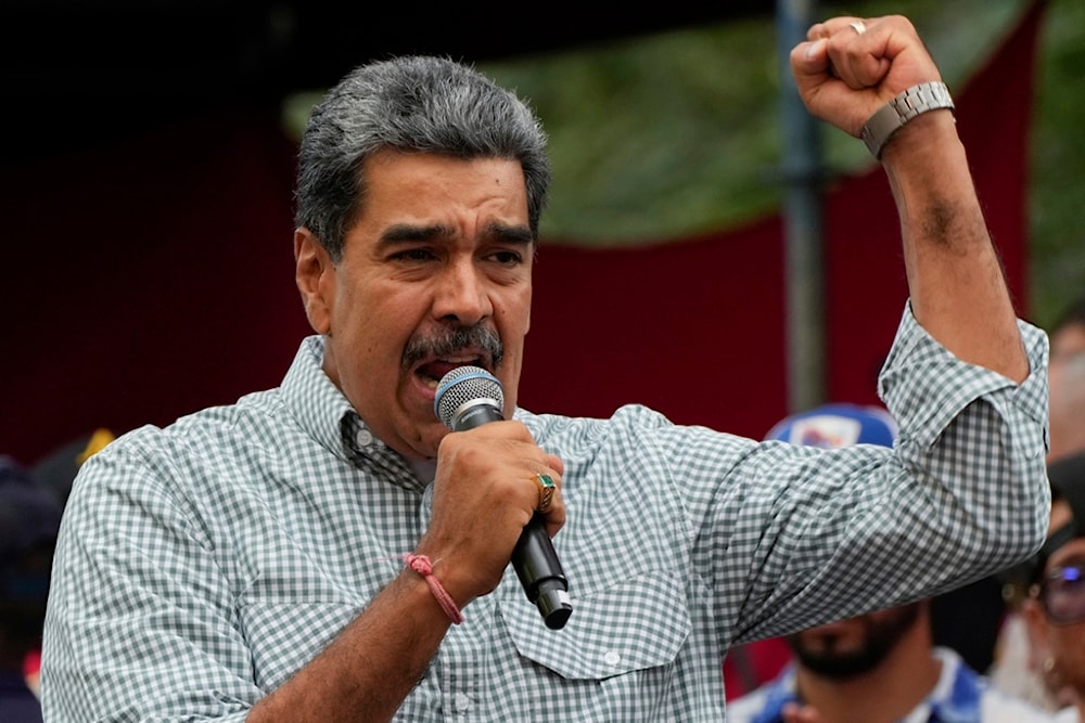 Venezuela's President Nicolas Maduro addresses crowds gathered at the presidential palace in support of his reelection one month after the presidential vote, in Caracas, Venezuela, Aug. 28, 2024. (AP)