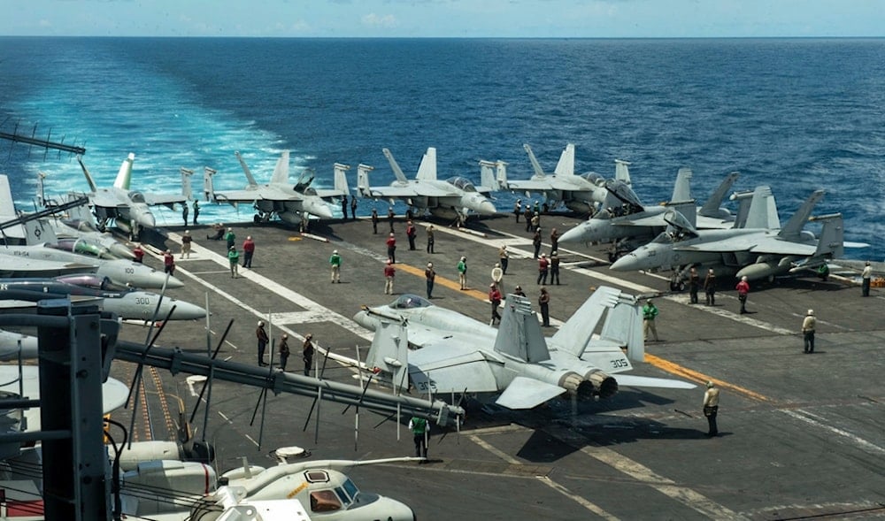 In this photograph released by the US Navy, the flight deck of the Nimitz-class aircraft carrier USS Theodore Roosevelt is seen July 4, 2024, in the South China Sea. (AP)