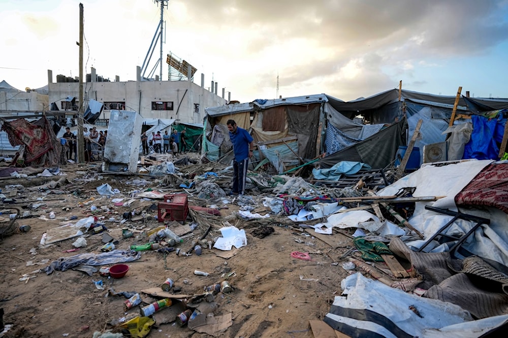 Palestinians inspect the damage at a tent area in the courtyard of Al Aqsa Martyrs Hospital, hit by an Israeli bombardment on Deir al-Balah, central Gaza Strip, Thursday, Sept. 5, 2024. (AP)