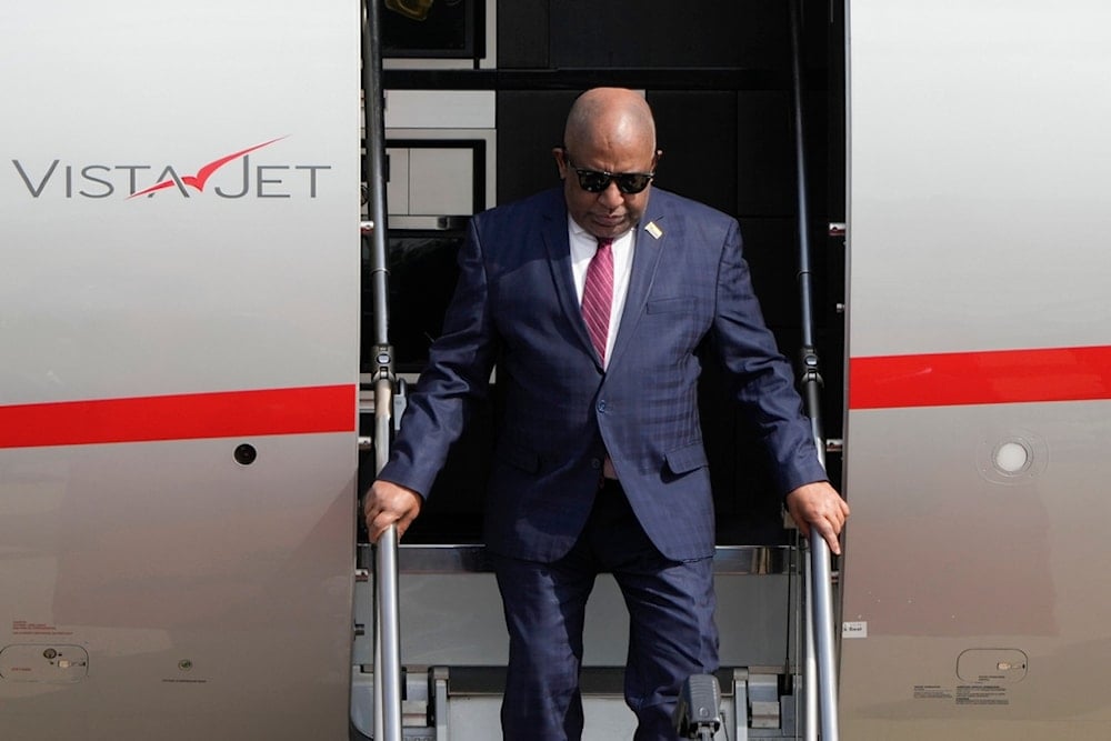 Comoros' President Azali Assoumani steps out from a plane as he arrives at the Beijing Capital International Airport to attend the China Africa Forum, in Beijing, Sunday, September 1, 2024 (AP)