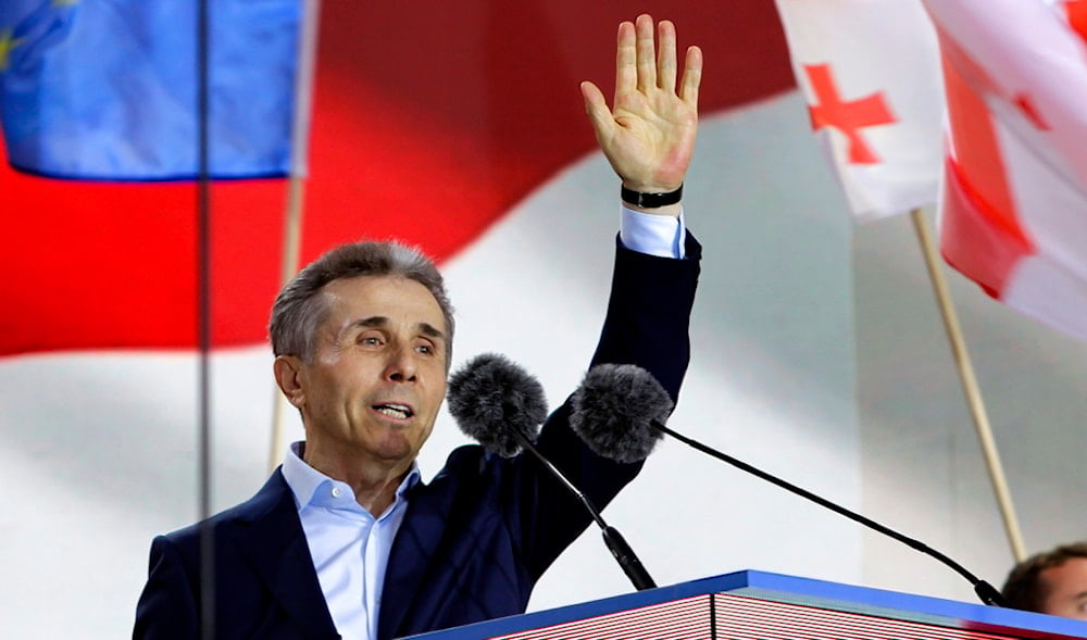 Bidzina Ivanishvili, leader of the Georgian Dream Party, greets demonstrators during a rally in support of 