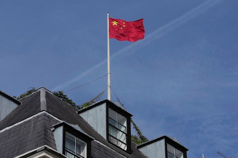 Chinese national flag is raised at the Chinese embassy in London, United Kingdom, Sept. 11, 2023. (AP)