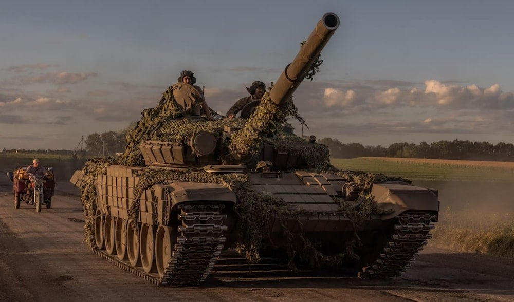 Ukrainian servicemen operate a Soviet-made T-72 tank in the Sumy region, near the border with Russia, on August 12, 2024. (AFP)