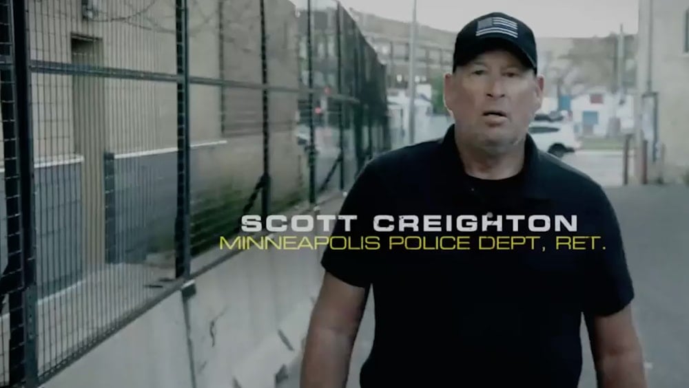 An image from video shows retired Minneapolis police officer Scott Creighton in an ad sponsored by the pro-Trump group Preserve America PAC. (Preserve America PAC)