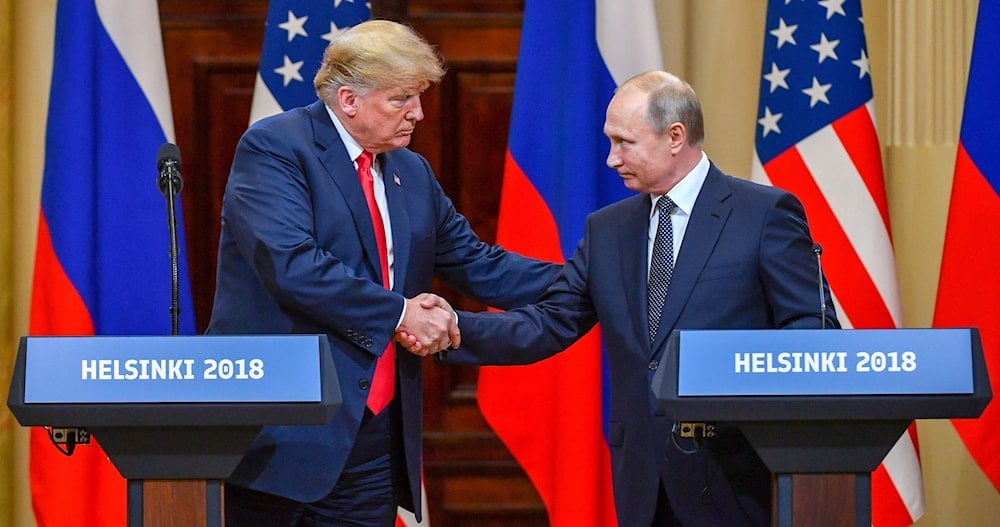 Former US President Donald Trump shakes hands with Russian President Vladimir Putin at the end of their summit in Helsinki, Finland, on July 16, 2018. (AFP)