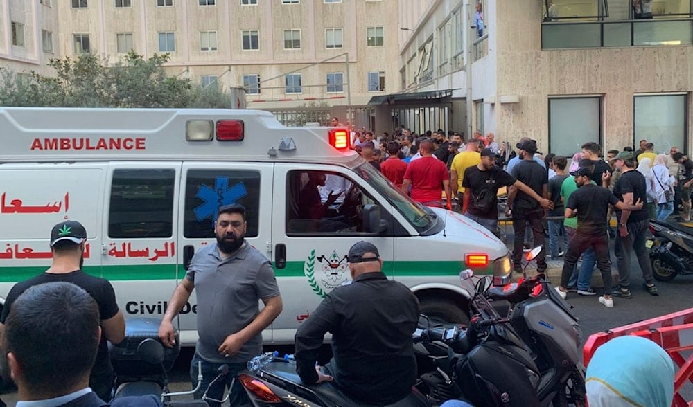 People gathered outside the American University hospital after the arrival of several men who were wounded by exploded handheld pagers, in Beirut, Lebanon, on September 17, 2024. (AP)