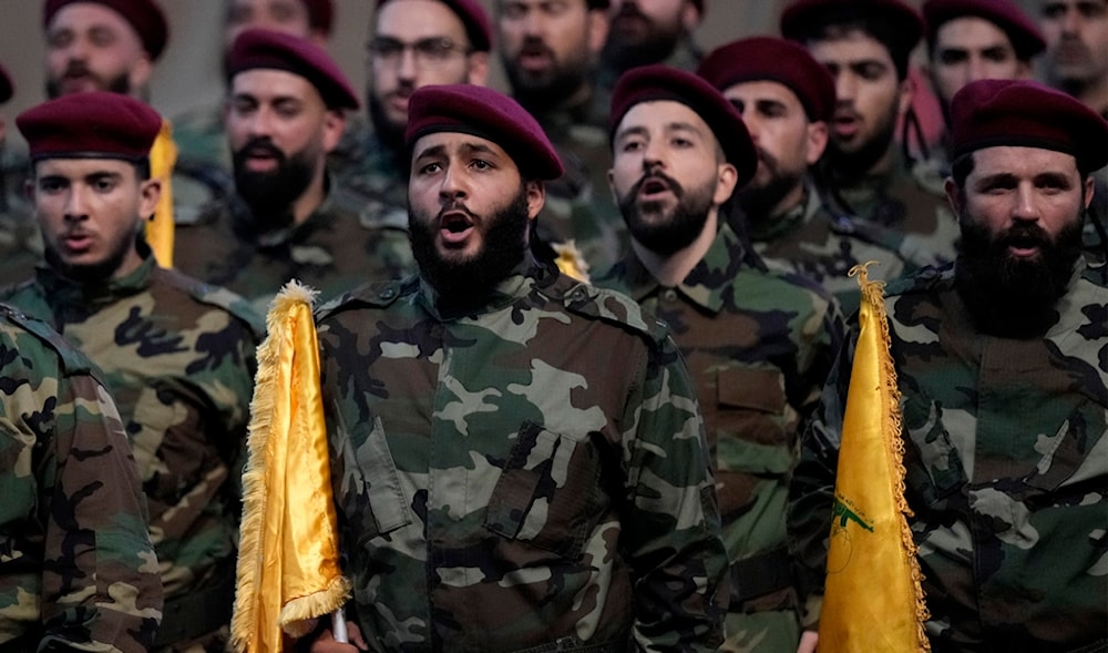 Hezbollah fighters shout slogans during the funeral procession in a southern suburb of Beirut, Lebanon, Aug. 1, 2024. (A)