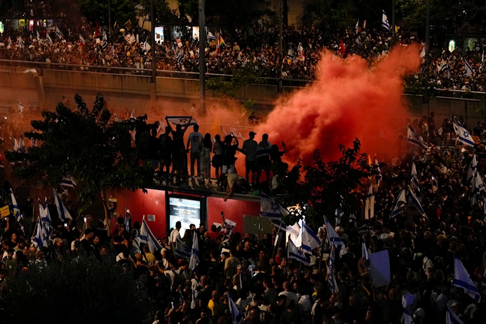 Israeli settlers take part in a protest calling for a deal for the immediate release of captives held in the Gaza Strip, in Tel Aviv, occupied Palestine, Sunday, Sept. 1, 2024. (AP)