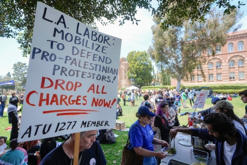 UCLA workers, students, and supporters get lunch after a rally at Royce Quad in the University of California, Los Angeles, UCLA campus, on Tuesday, May 28, 2024. (AP)