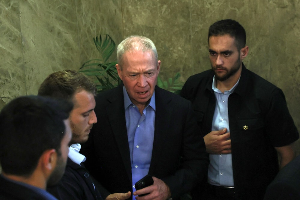 Israel's Defence Minister Yoav Galant, center, arrives to attend the weekly cabinet meeting at the prime minister's office in occupied al-Quds, 'Israel', on July 9, 2023. (AP)