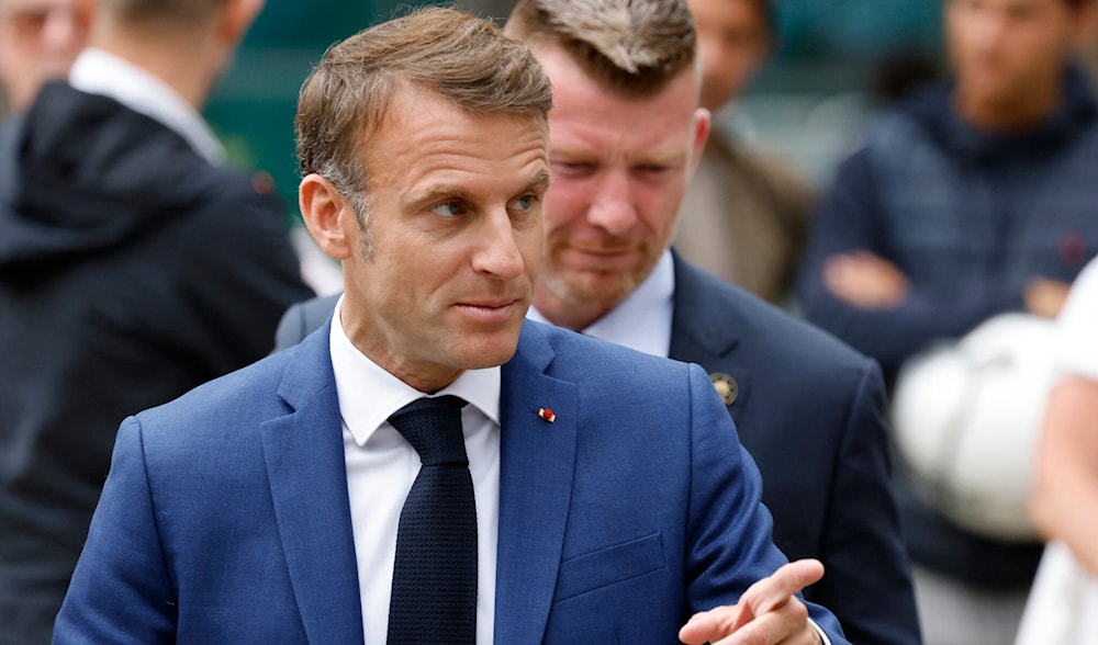 France's President Emmanuel Macron leaves the polling station after voting for the first round of parliamentary elections in Le Touquet, northern France on June 30, 2024. (AFP)