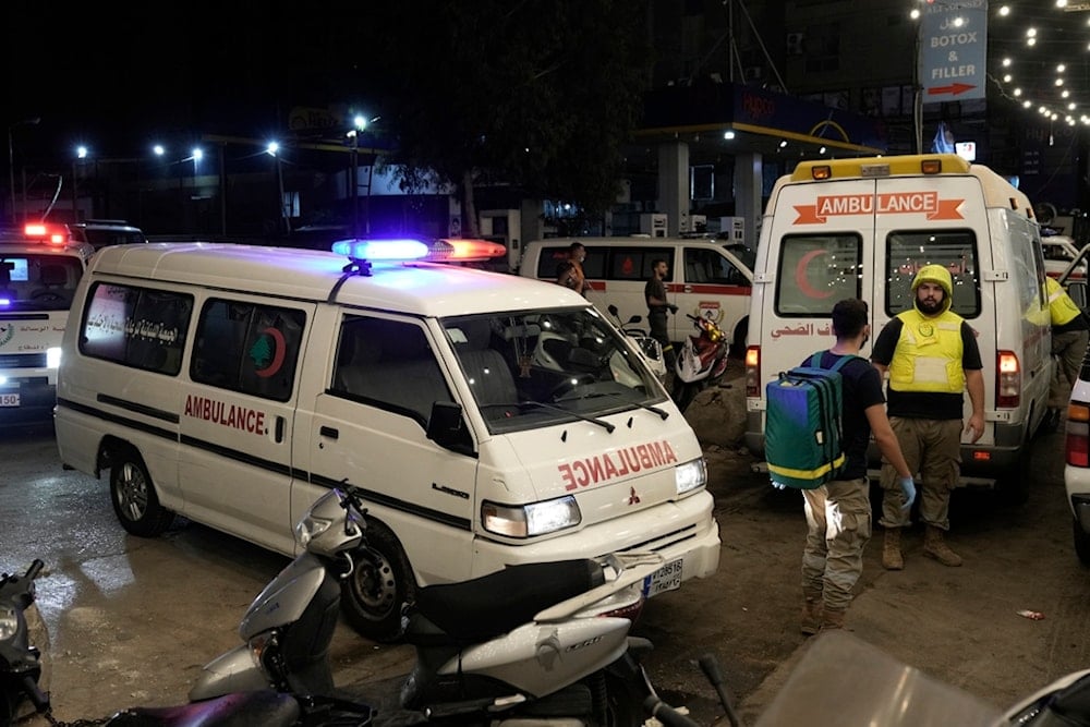 Ambulances arrive to evacuate the wounded near the site of an Israeli airstrike in Beirut's southern suburb, Monday, September 23, 2024 (AP)