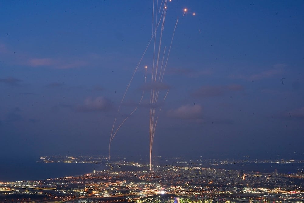 Israeli Iron Dome air defense system fires to intercept rockets that were launched from Lebanon, as seen from Haifa, northern occupied Palestine, Monday, Sept. 23, 2024. (AP Photo/Baz Ratner)