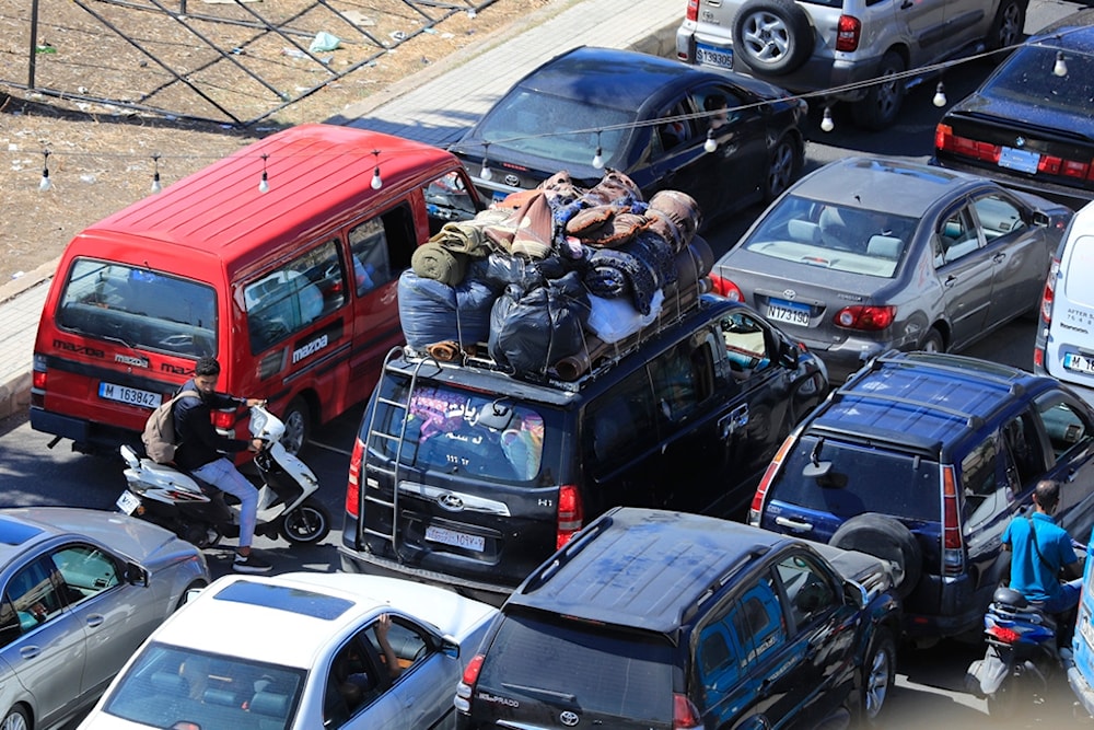 Cars sit in traffic in the southern city of Sidon, as they flee the southern villages amid ongoing Israeli airstrikes, Monday, Sept. 23, 2024. (AP Photo/Mohammed Zaatari)