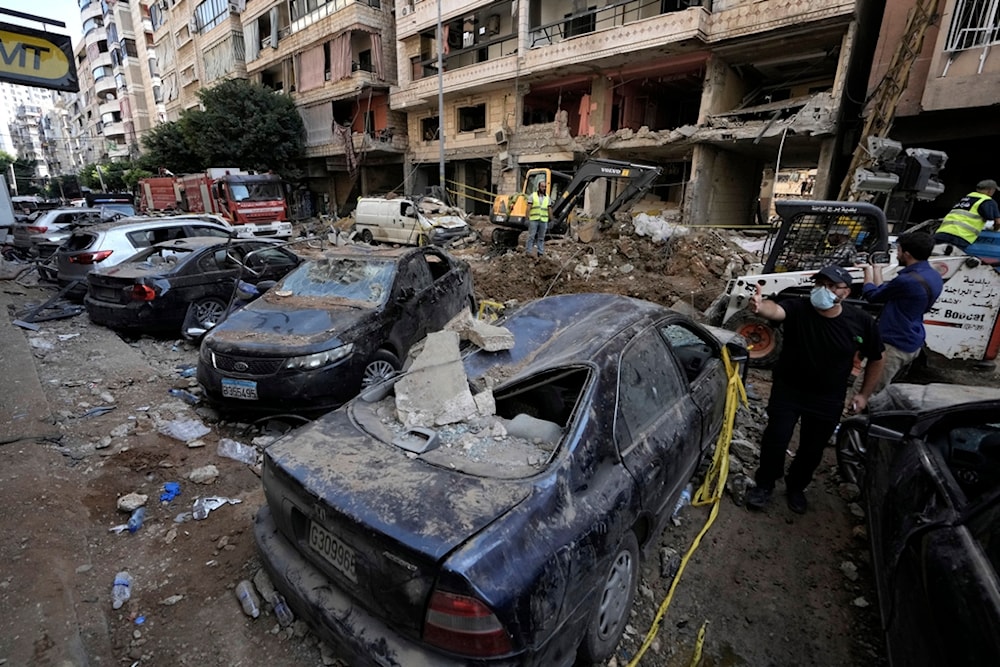 Damaged cars at the site of Friday's Israeli strike in Beirut's Southern Suburb, Saturday, Sept. 21, 2024 (AP)