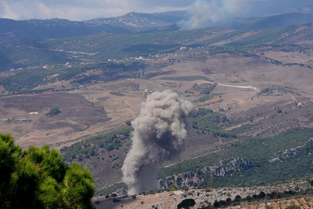 Smoke rises from an Israeli airstrike on a valley near Marjayoun town, south Lebanon, on September 21, 2024. (AP)