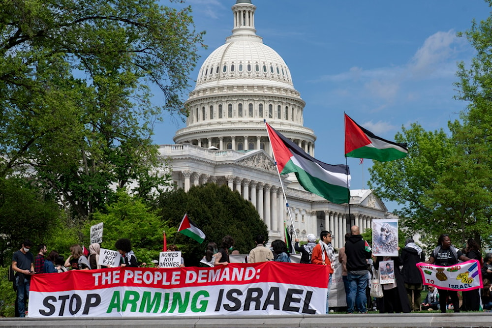 Pro-Palestinian activists demonstrate outside the Capitol in Washington, Saturday, April 20, 2024, as the House prepares to vote on approval of $95 billion in foreign aid for Ukraine, 