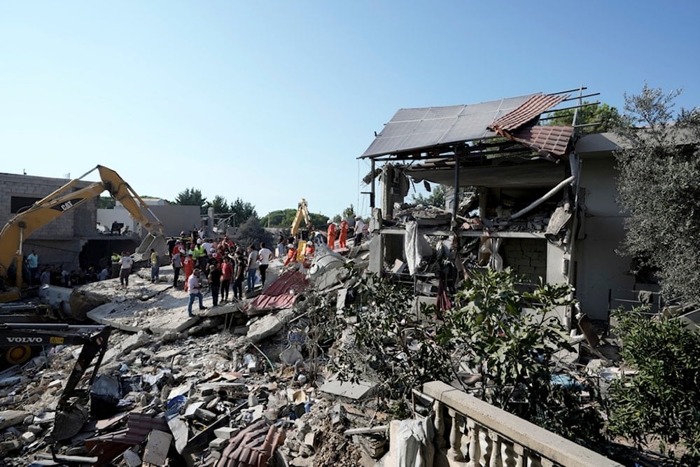 Emergency workers arrive at the scene of an Israeli airstrike in the town of Maisara, north of Beirut, Wednesday, Sept. 25, 2024. (AP)