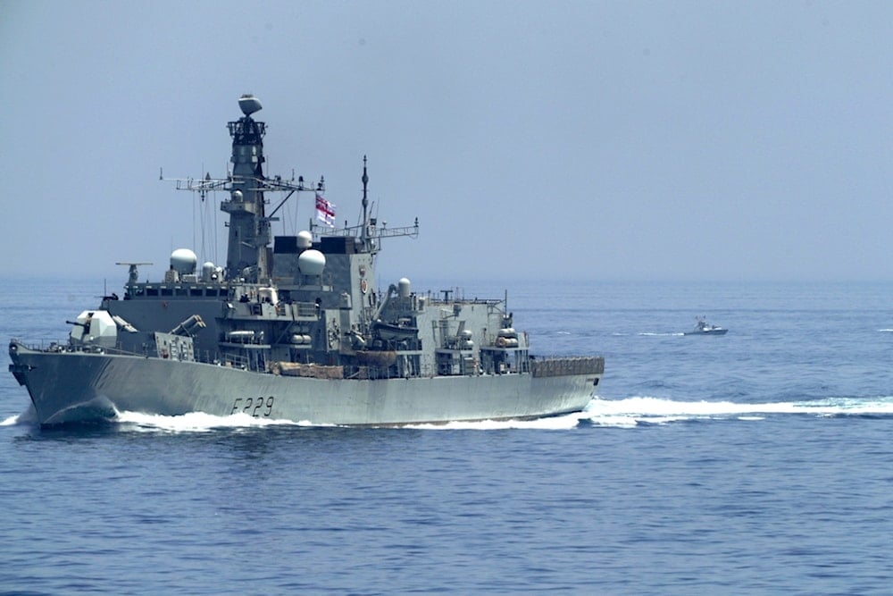 The British frigate HMS Lancaster sails as Iranian Revolution Guard vessels follow behind it in the Strait of Hormuz Friday, May 19, 2023 (AP)