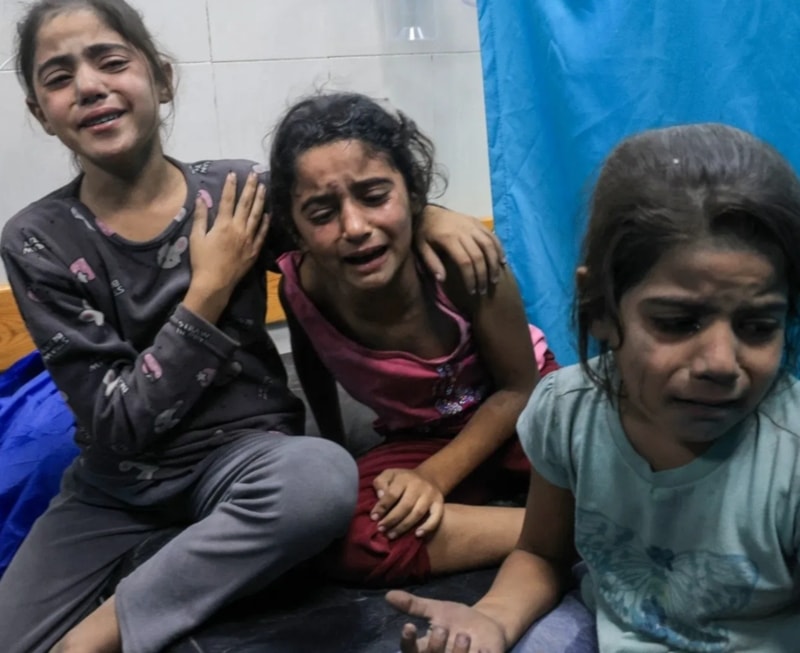 Palestinian children injuired in an Israeli airstrike await treatment at the Nasser Hospital in Khan Younis in southern Gaza, on October 17,2023. (AFP)