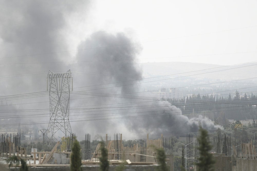  Smoke rises in the countryside of Damascus, Syria, on October 30, 2021, following an Israeli strike. (AP)