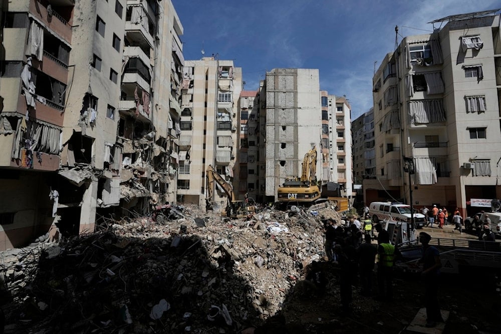 Emergency workers clear the rubble at the site of Friday's Israeli strike in Beirut's Southern Suburb, Sunday, September 22, 2024 (AP) 