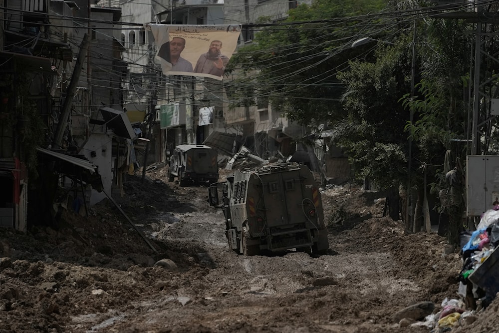 A convoy of Israeli military armored vehicles is seen during an army raid in Tulkarem, West Bank, on September 3, 2024. (AP)