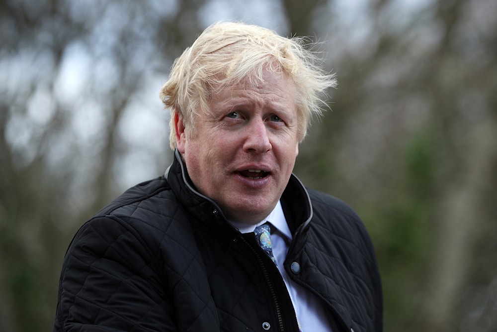 Britain's Prime Minister Boris Johnson arrives for a visit to Healey's Cornish Cyder Farm during the General Election campaign, in Callestick, England, on November 27, 2019. (AP)