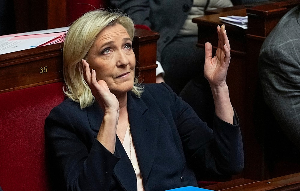 French far-right National Rally party leader Marine Le Pen reacts during the speech of French Prime Minister Gabriel Attal at the National Assembly, on January 30, 2024 in Paris. (AP)